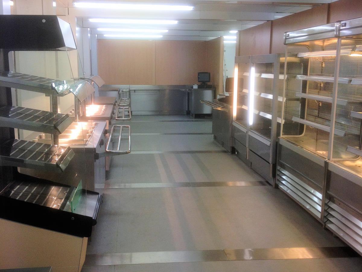 Full service area with servery equipment and refrigerated cabinets.